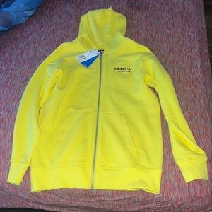 A yellow adidas hoodie brand new size Large